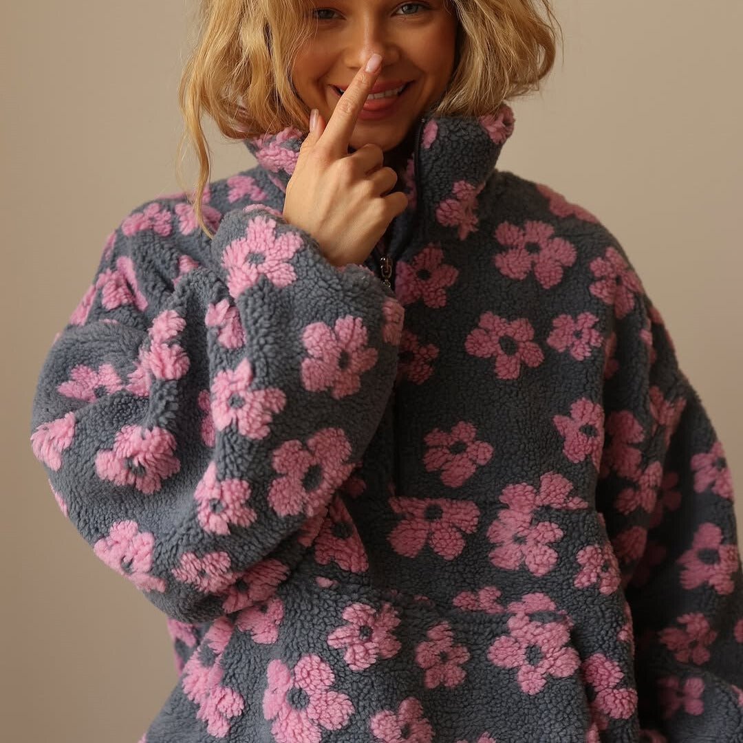 Lieve | Oversized teddyfleecejas met bloemenprint en halve ritssluiting