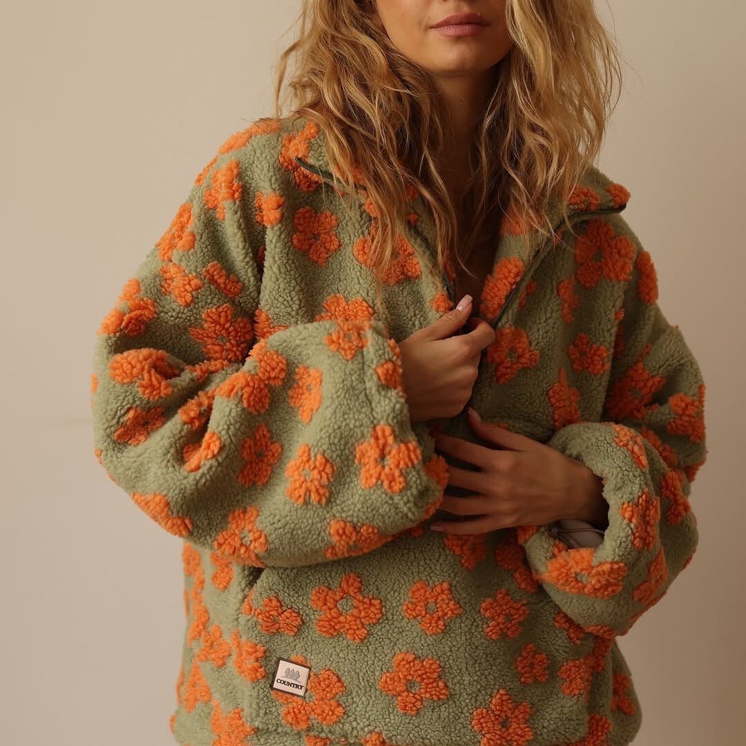 Lieve | Oversized teddyfleecejas met bloemenprint en halve ritssluiting