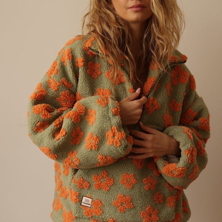 Lieve | Oversized teddyfleecejas met bloemenprint en halve ritssluiting